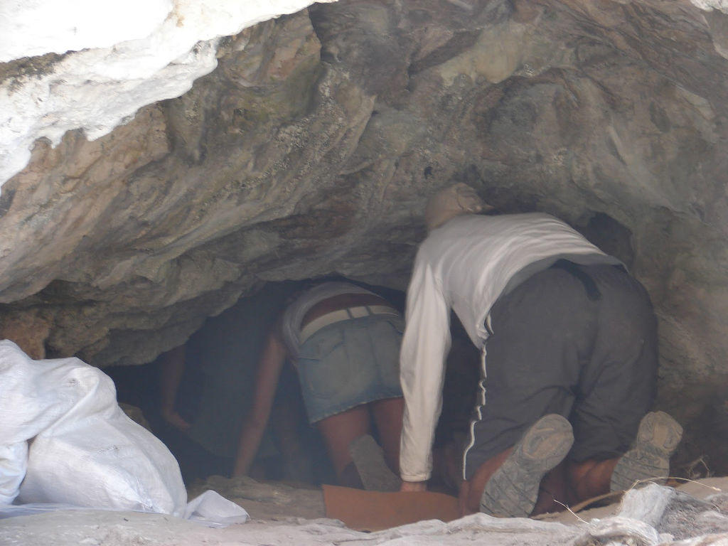 Herakleia, Festival of St. John the Baptist - Gastronomy Tours people go down on their knees into a cave at the Church of St. John the Baptist commemorate festival of her birth at Herakleia, Greece